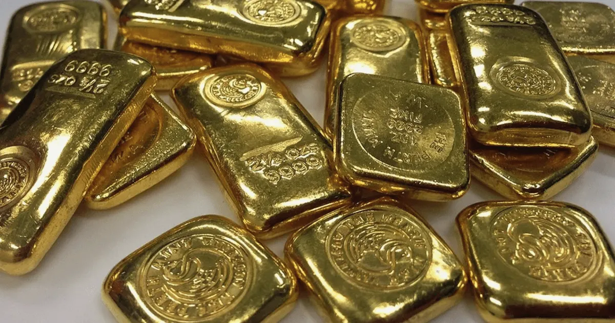 Ouro cai com dólar americano mais forte pressionando o metal