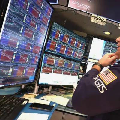 Dow drops 900 points as chip stocks slide, Trump threatens Iran strikes
