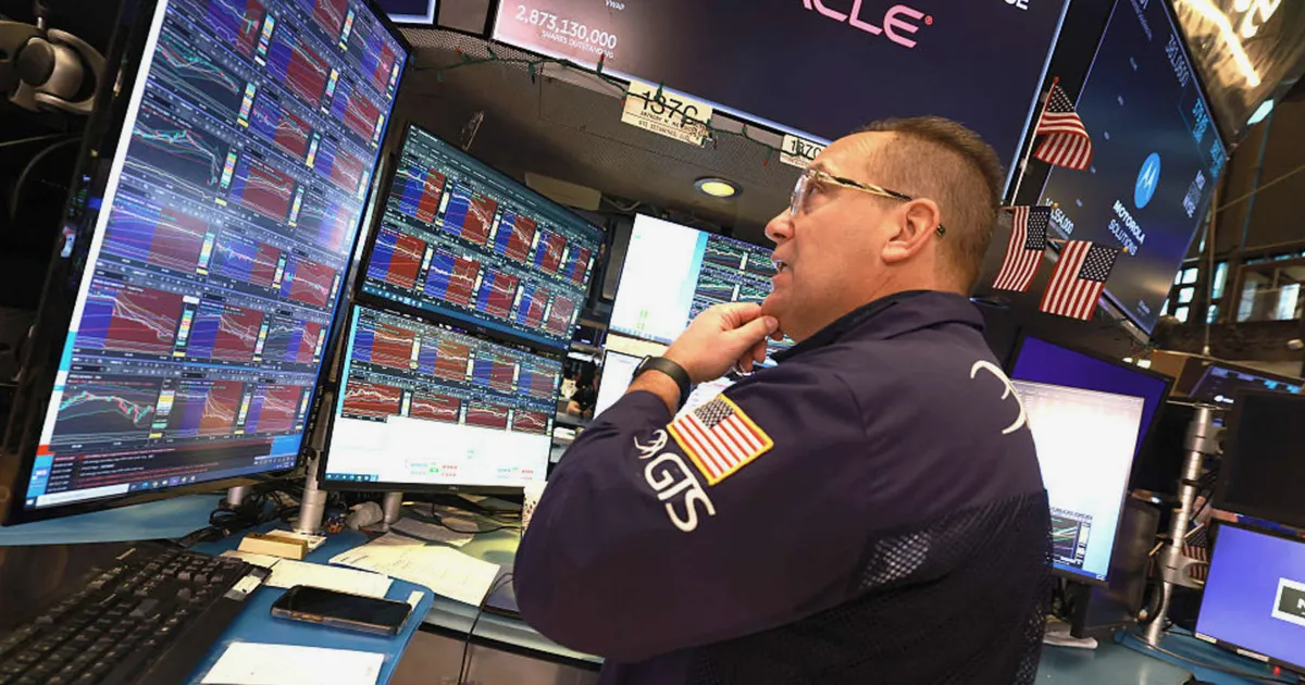 Dow drops 900 points as chip stocks slide, Trump threatens Iran strikes
